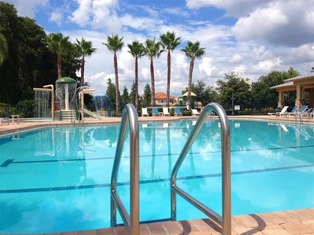 an aerial view of a house with table and chairs