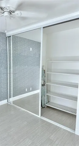 a view of an empty room with a bathroom