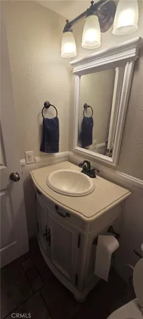 a bathroom with a sink and mirror