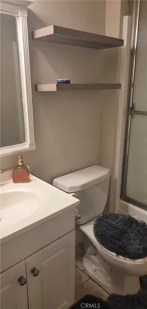 a bathroom with a toilet and a sink