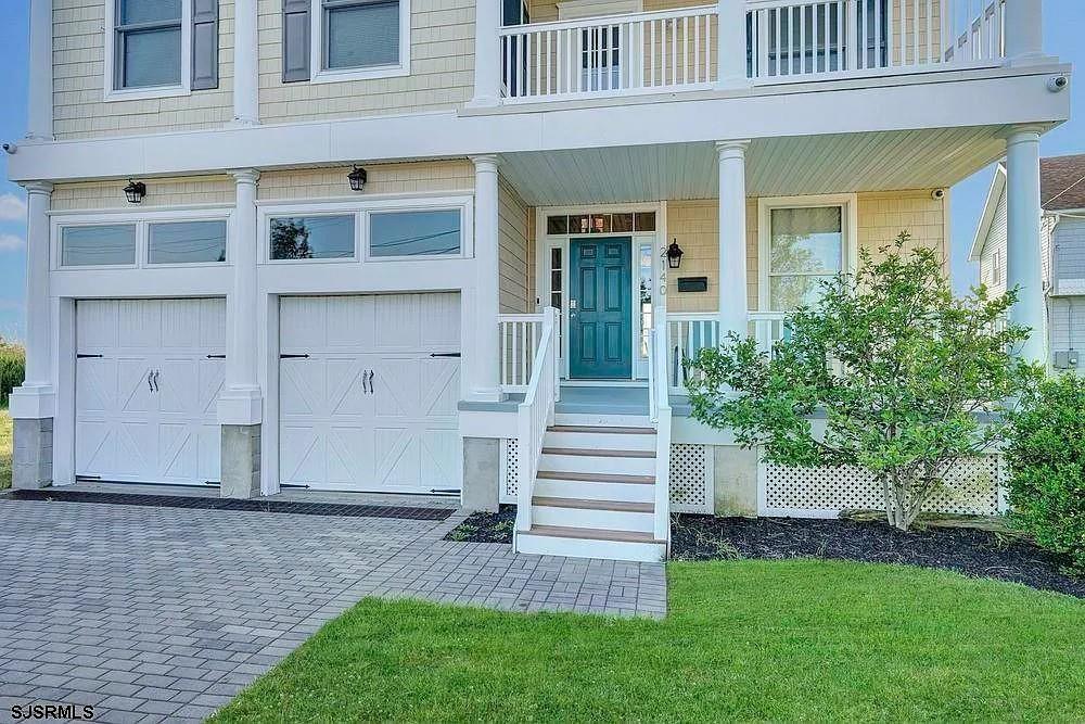2140 West Riverside Drive Atlantic City, NJ 08401 - Photo 2 of 30 front view of a house with a yard