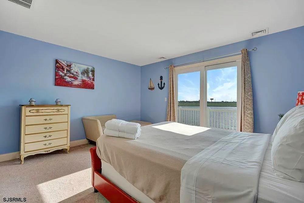 2140 West Riverside Drive Atlantic City, NJ 08401 - Photo 21 of 30 a bedroom with a bed and a window