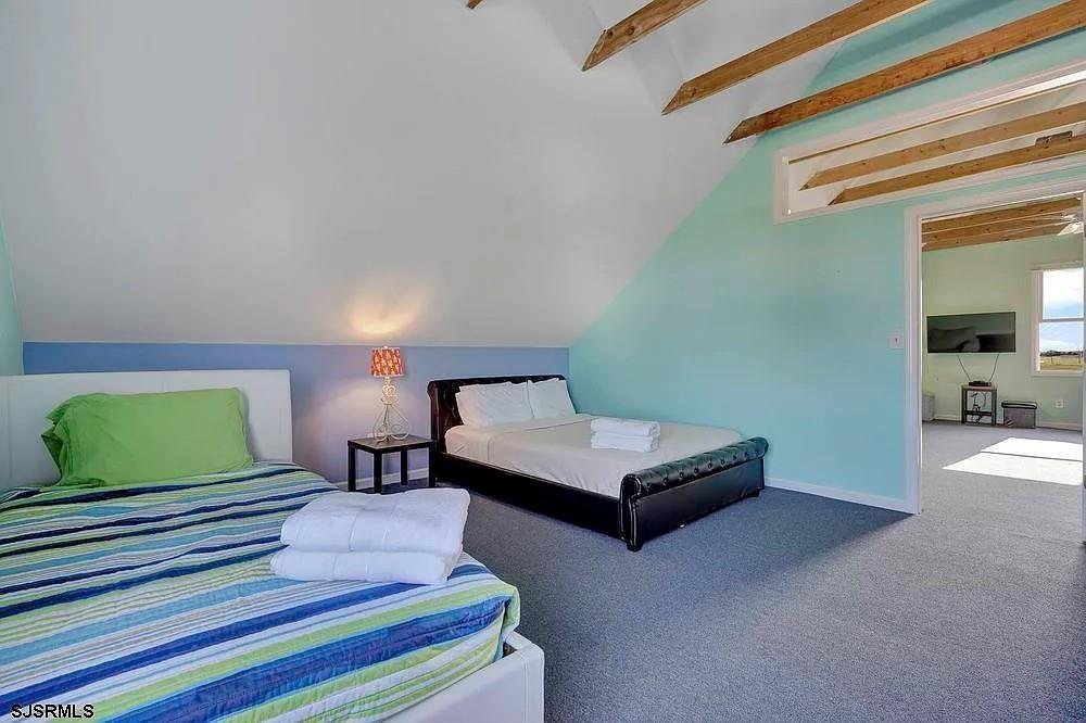 2140 West Riverside Drive Atlantic City, NJ 08401 - Photo 29 of 30 a bedroom with a bed and a lamp on dresser