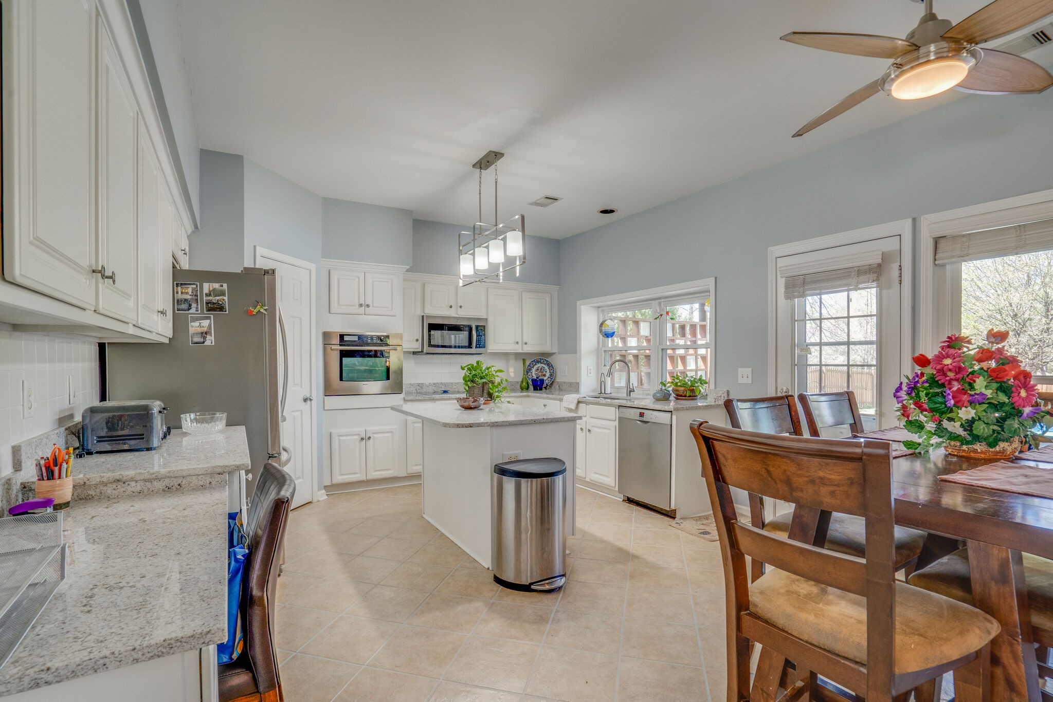 305 Knowle Place Franklin, TN 37069 - Photo 13 of 34 a kitchen with sink cabinets and window