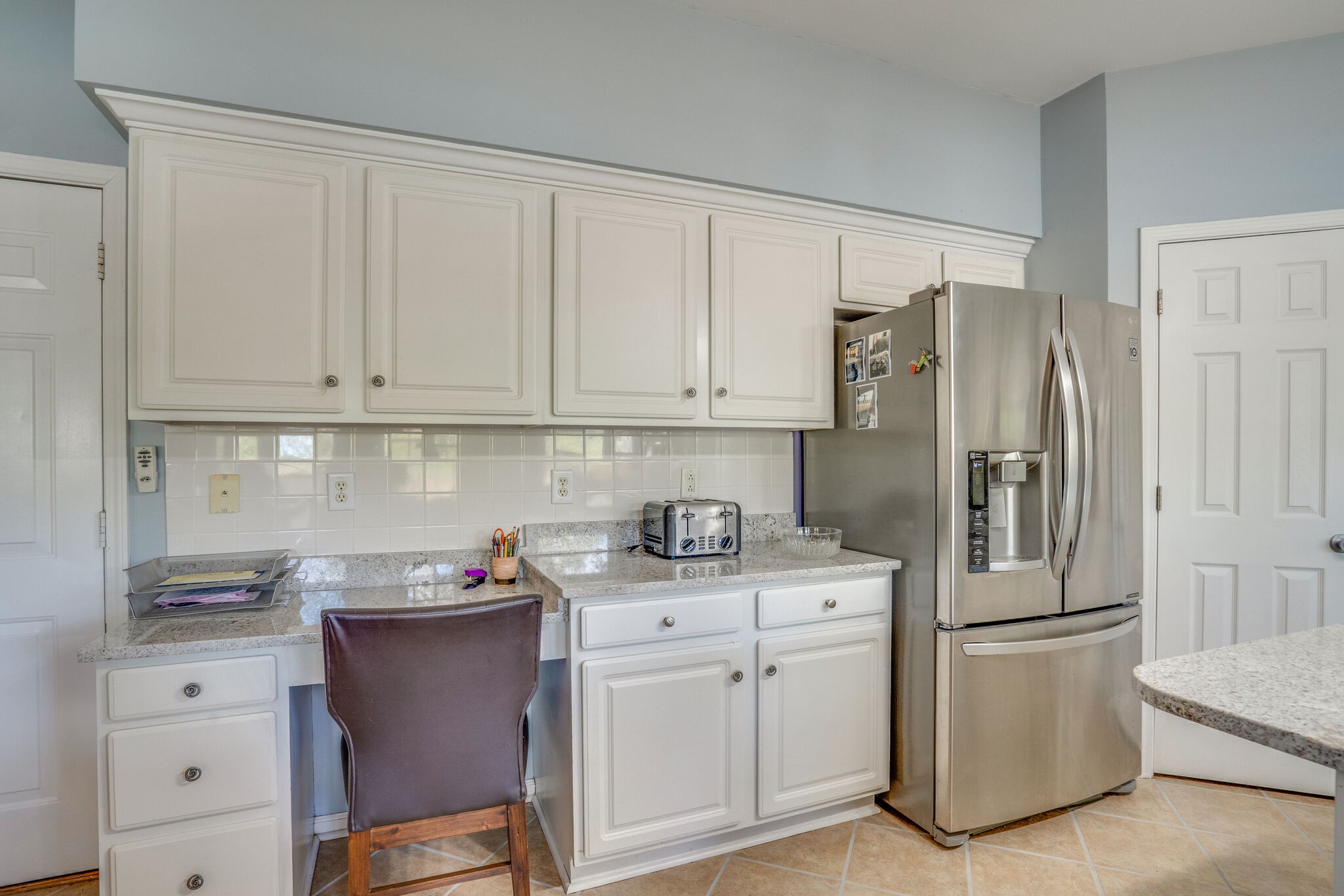 305 Knowle Place Franklin, TN 37069 - Photo 15 of 34 a kitchen with stainless steel appliances granite countertop a refrigerator sink and white cabinets