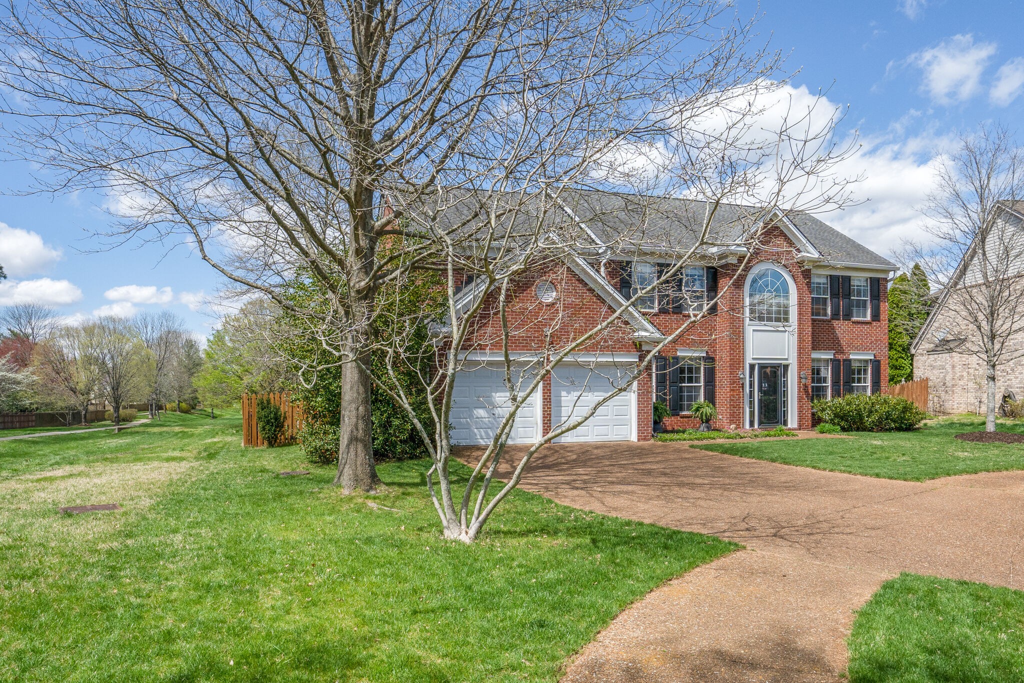 305 Knowle Place Franklin, TN 37069 - Photo 2 of 34 a front view of a house with a yard