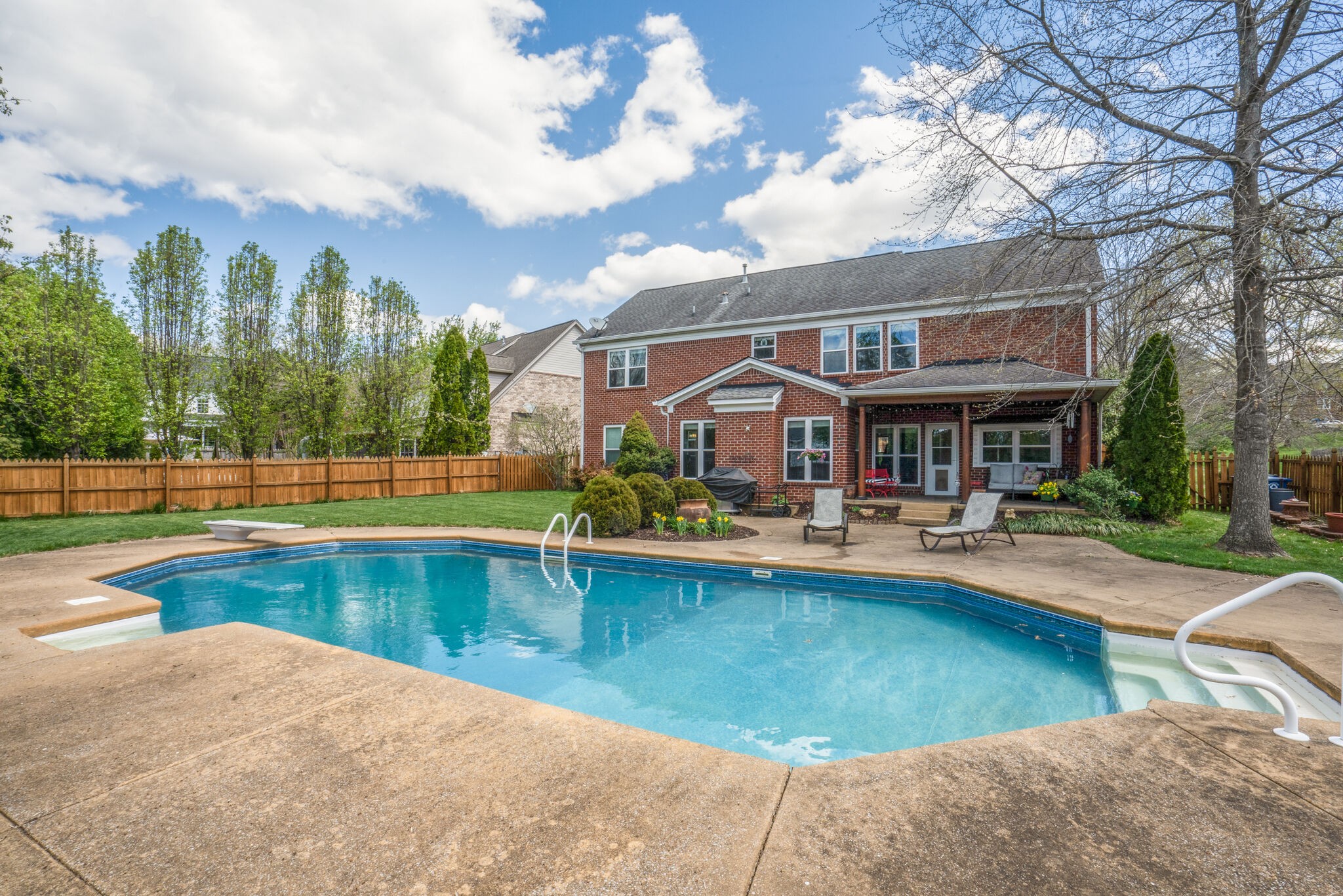305 Knowle Place Franklin, TN 37069 - Photo 31 of 34 a front view of a house with swimming pool having outdoor seating