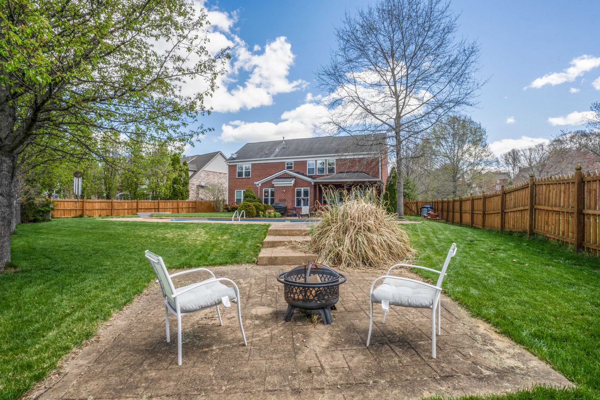 305 Knowle Place Franklin, TN 37069 - Photo 33 of 34 a view of a chair and table in backyard of the house