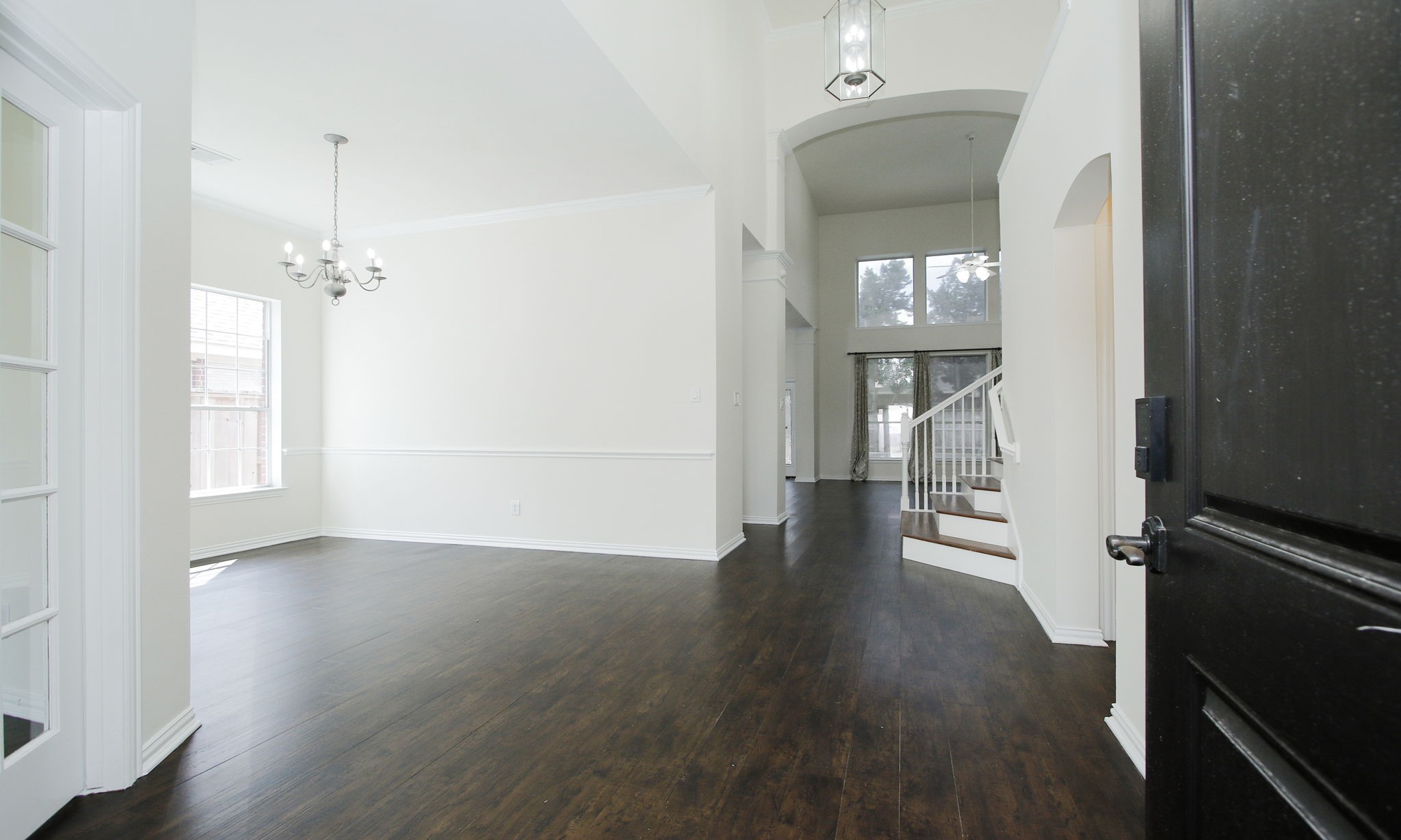 1210 Berwick Manor Court Spring, TX 77379 - Photo 11 of 50 wooden floor in an empty room with a window