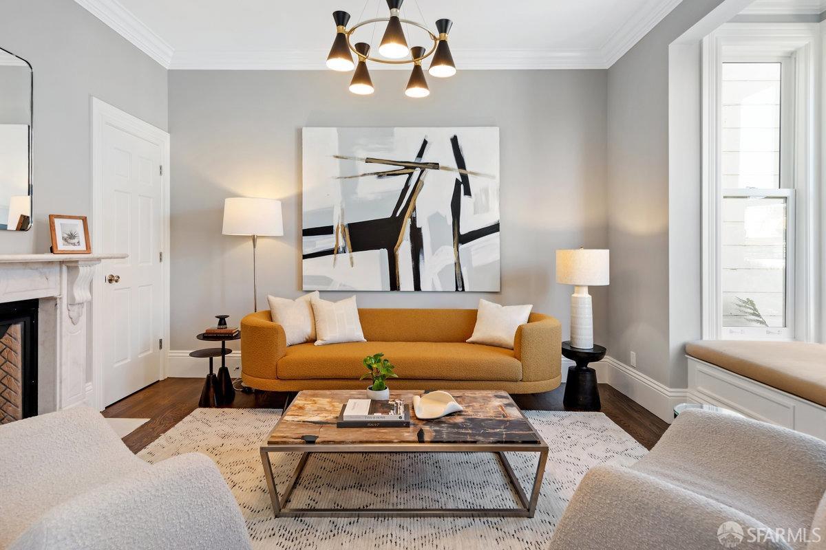 369 Day Street San Francisco, CA 94131 - Photo 11 of 54 a living room with furniture a fireplace and a chandelier
