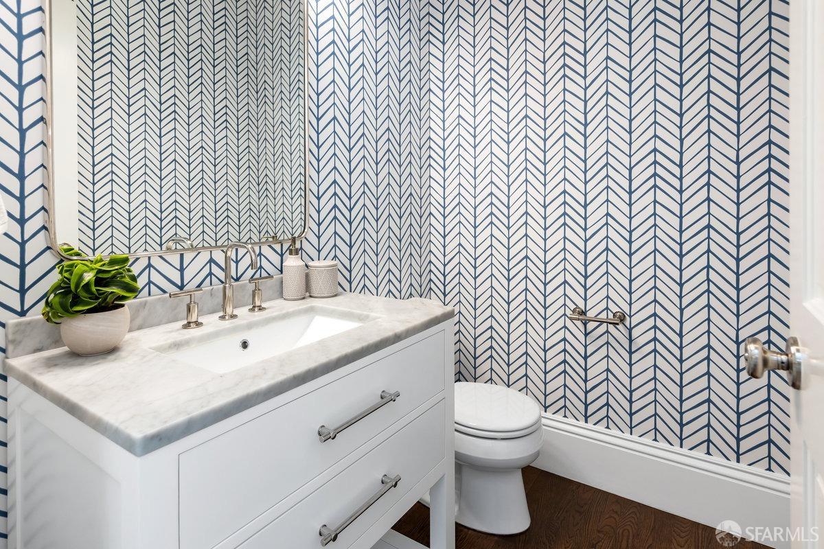 369 Day Street San Francisco, CA 94131 - Photo 14 of 54 a bathroom with a sink a toilet and mirror