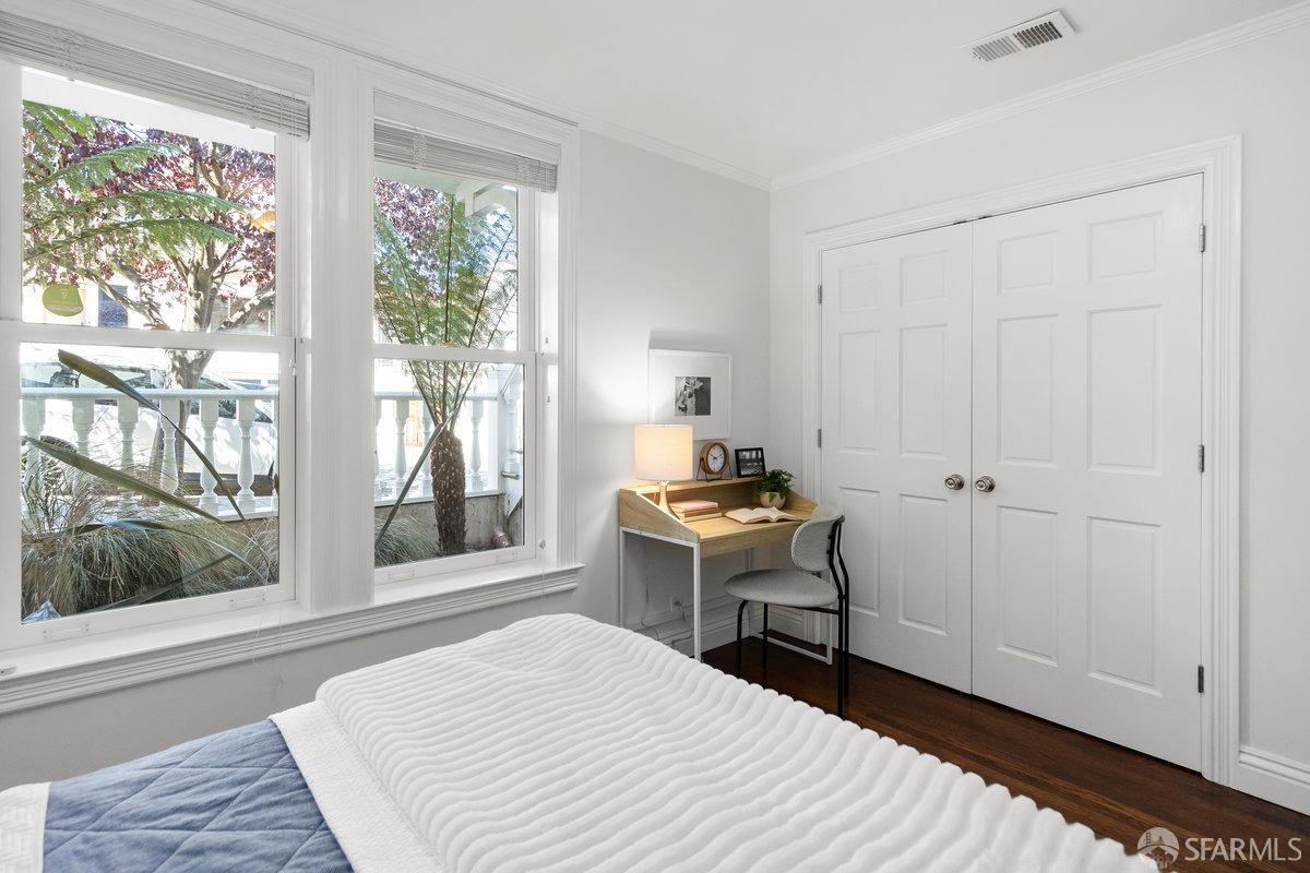 369 Day Street San Francisco, CA 94131 - Photo 20 of 54 a room that has a bed and a window in it