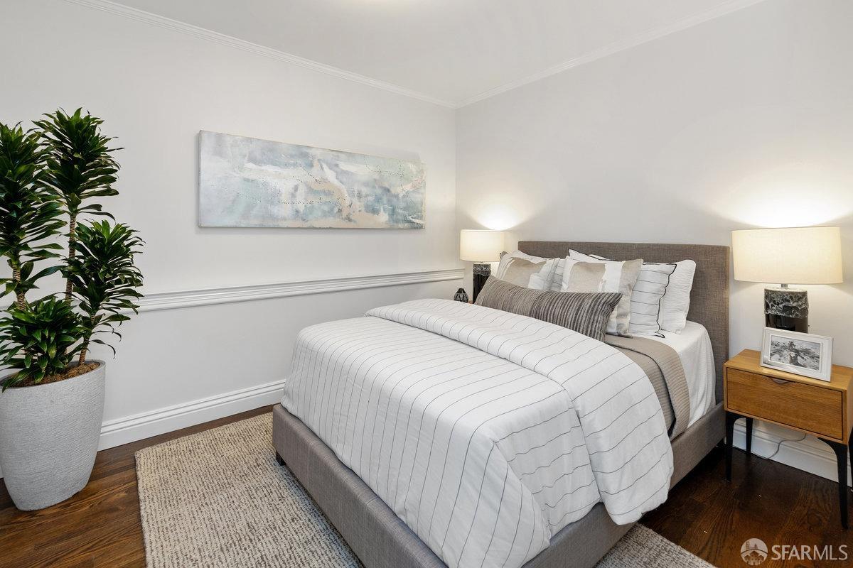 369 Day Street San Francisco, CA 94131 - Photo 22 of 54 a bedroom with a bed and a potted plant