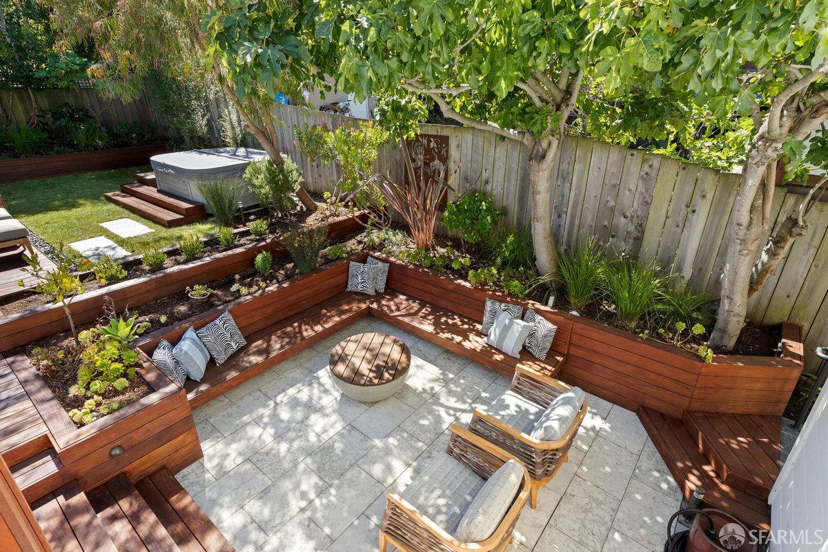 369 Day Street San Francisco, CA 94131 - Photo 23 of 54 a view of a backyard with chairs and a potted plant
