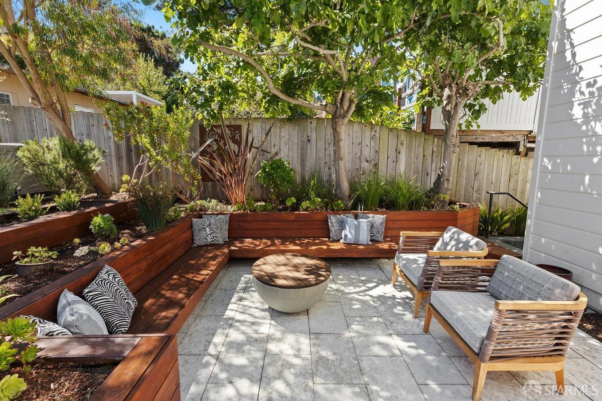 369 Day Street San Francisco, CA 94131 - Photo 24 of 54 a view of a patio with couches and a table and chairs with wooden fence