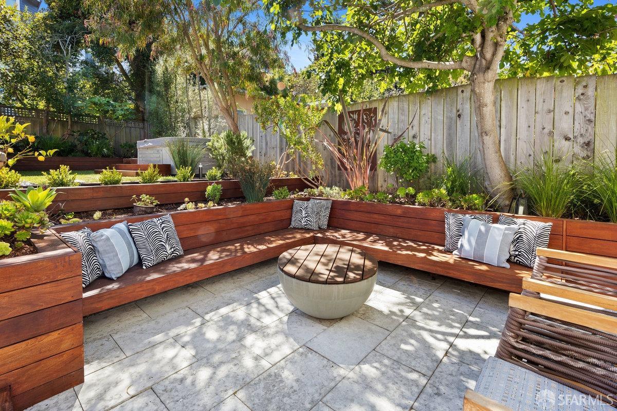 369 Day Street San Francisco, CA 94131 - Photo 25 of 54 a backyard of a house with barbeque oven and outdoor seating