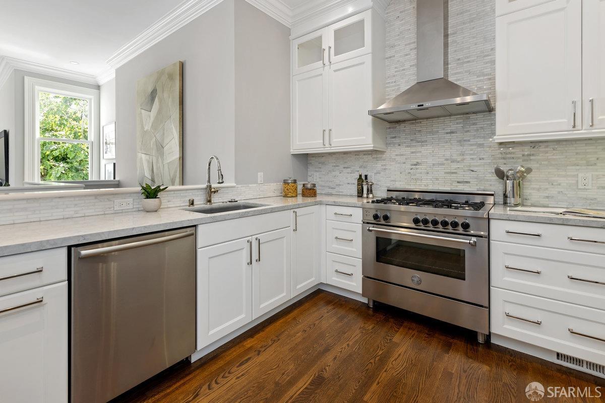 369 Day Street San Francisco, CA 94131 - Photo 7 of 54 a kitchen with stainless steel appliances granite countertop a sink a stove and cabinets