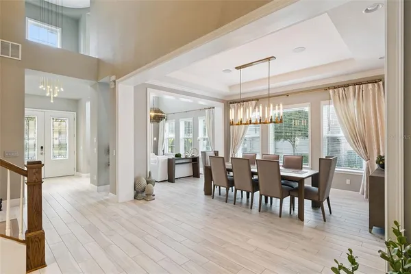 a view of a dining room with furniture and wooden floor