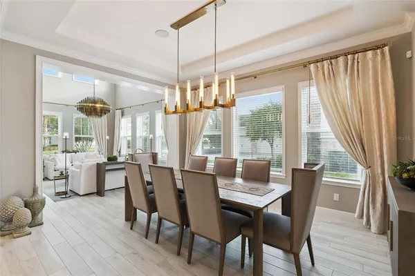 a view of a dining room with furniture window and outside view