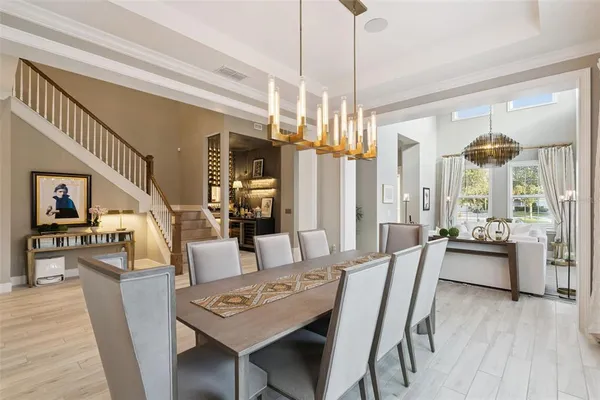 a kitchen with stainless steel appliances a center island cabinets and wooden floor