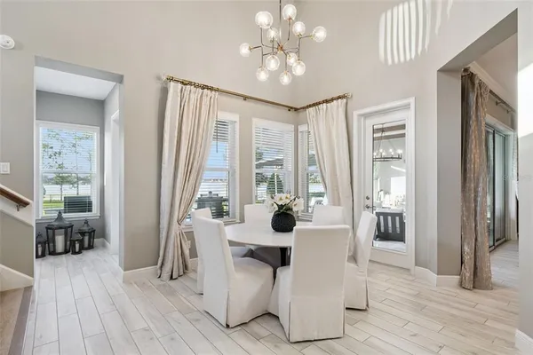 a bedroom with a bed next to a window