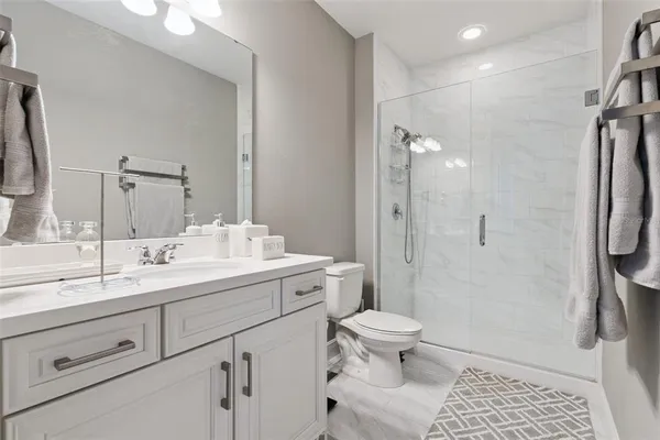 an aerial view of a house with garden space and outdoor seating