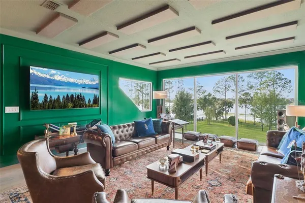 an aerial view of a houses with a lake view