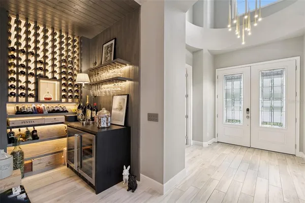 a living room with fireplace furniture and a wooden floor