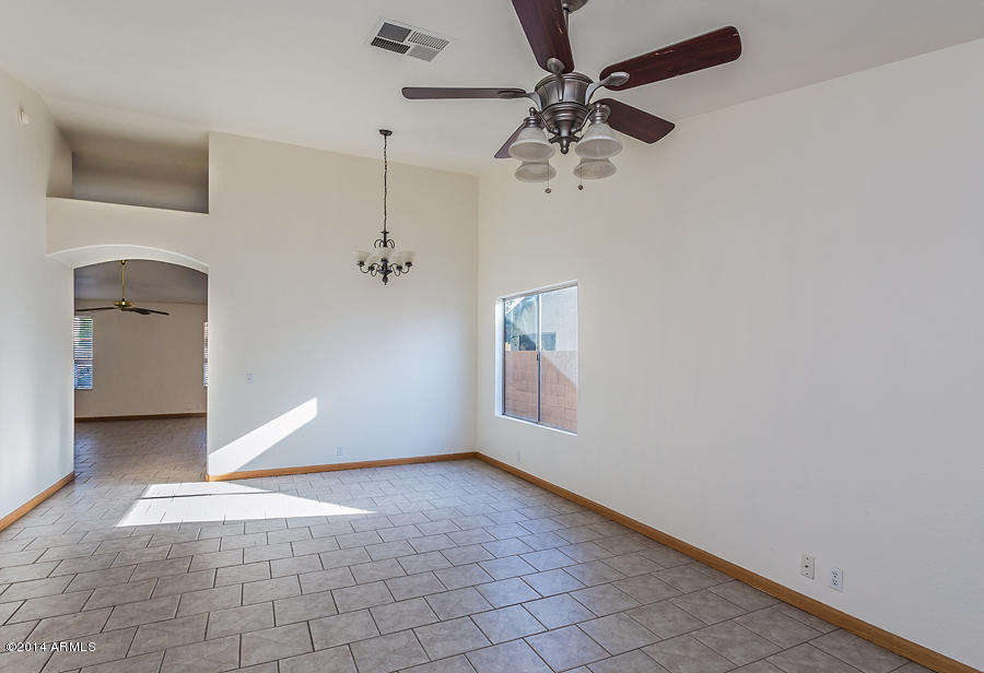 8755 West Ocotillo Road Glendale, AZ 85305 - Photo 4 of 12 Living Room Flows into Dining Room