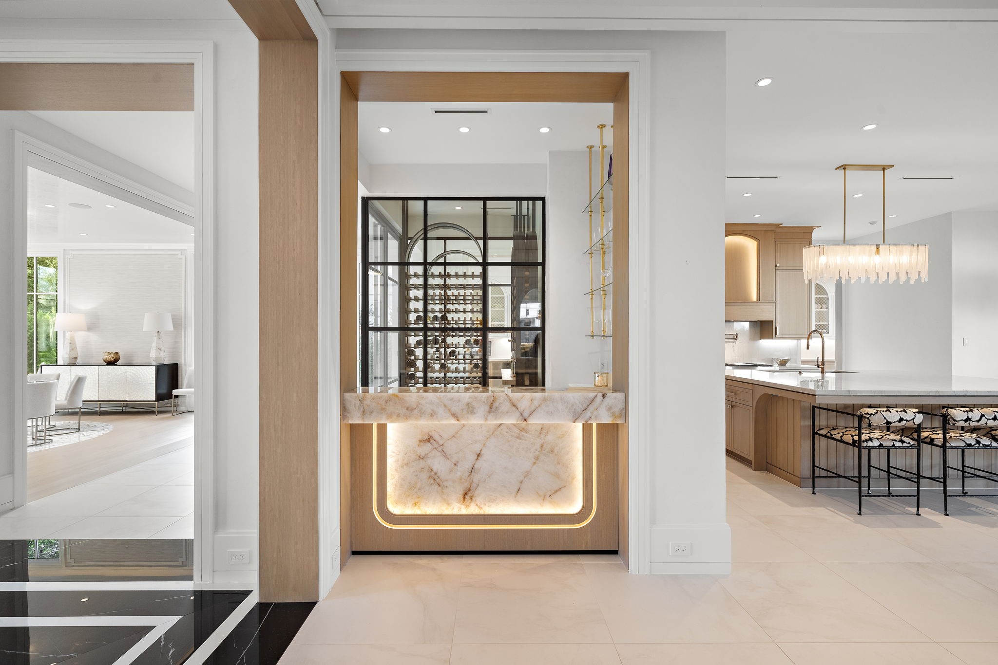 3649 Chevy Chase Drive Houston, TX 77019 - Photo 12 of 50 Backlit Cristallo quartzite define this signature bar, a glimpse of the meticulous detail found throughout the home and perfectly positioned for refined entertaining.