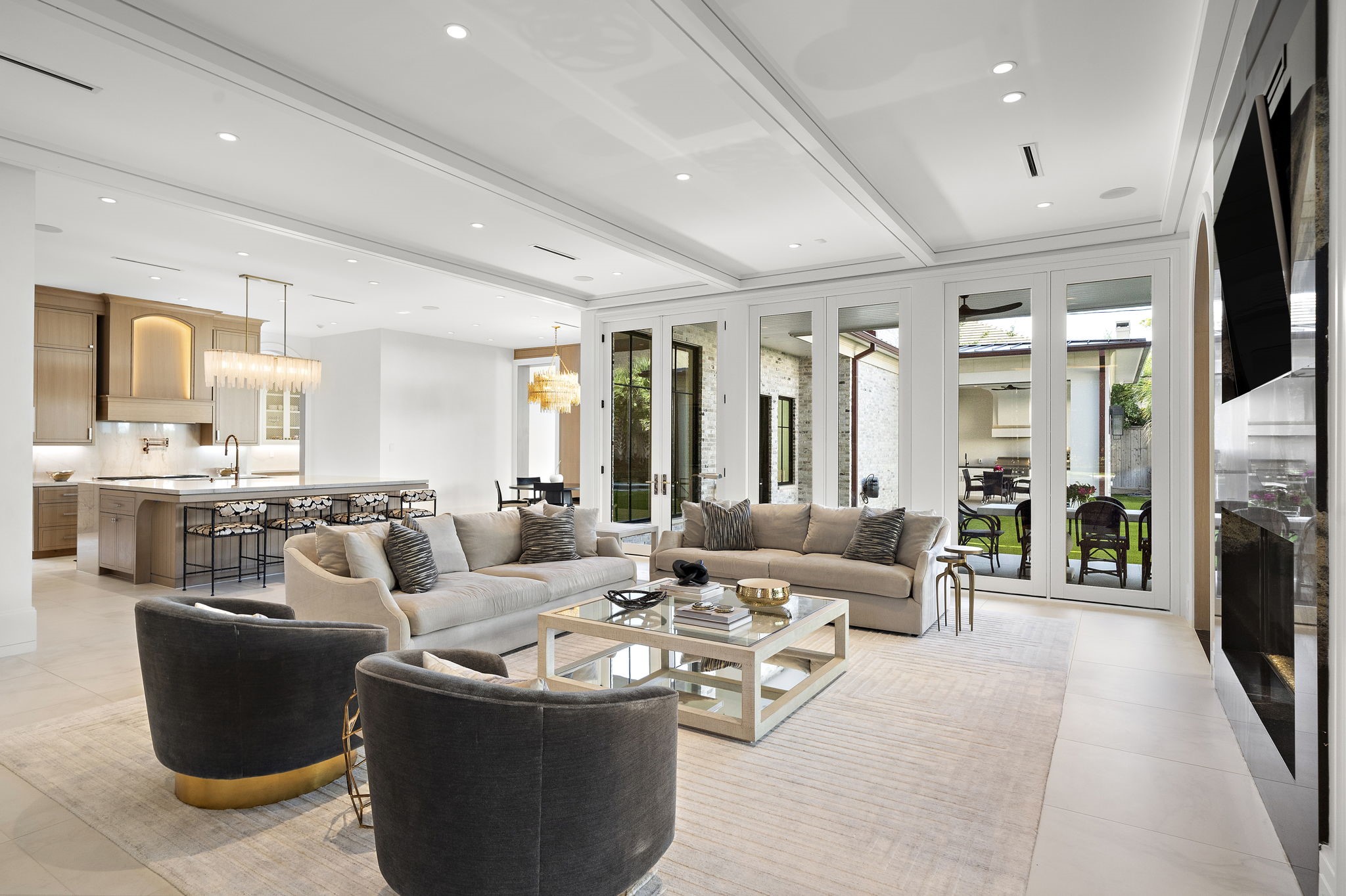 3649 Chevy Chase Drive Houston, TX 77019 - Photo 19 of 50 Light-filled 21' x 26' living space with floor-to-ceiling Windsor windows look out to the pool and manicured grounds.