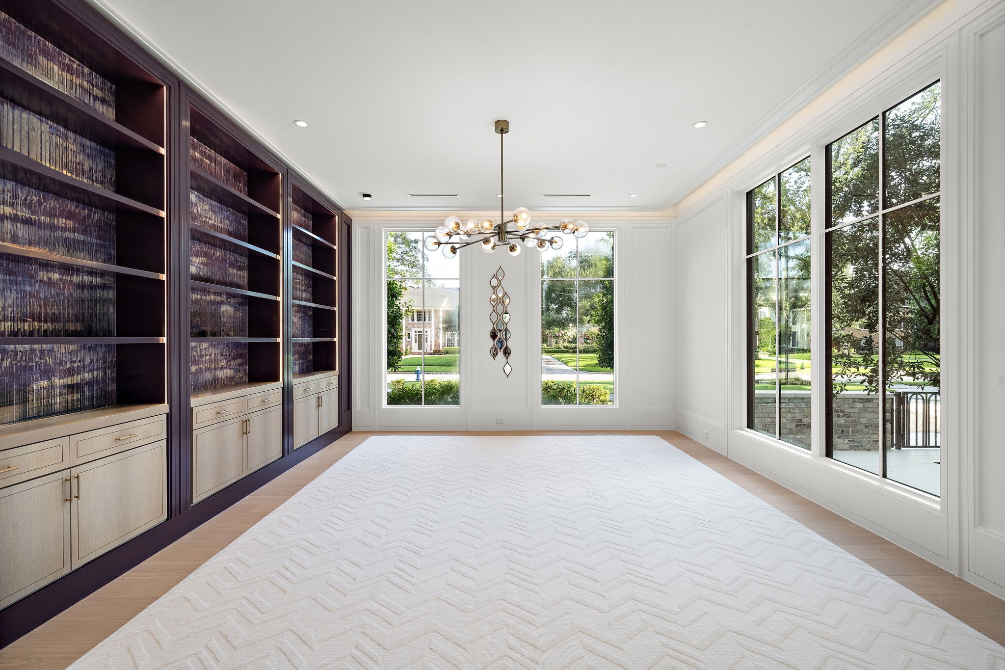 3649 Chevy Chase Drive Houston, TX 77019 - Photo 24 of 50 The study features lacquered cabinetry, 10” base moldings, graceful wood paneling, cove lighting, and floor-to-ceiling windows.