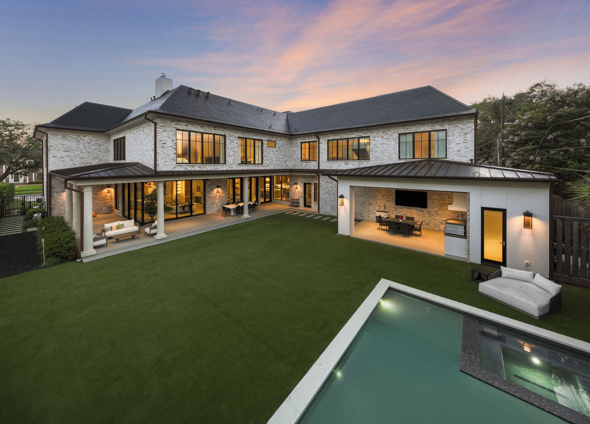 3649 Chevy Chase Drive Houston, TX 77019 - Photo 3 of 50 Unfolding like a private resort, the sleek pool and spa create a serene focal point, while the walls of glass dissolve the boundary between refined interiors and the outdoors. Premium features include whole-home generator, Control4 and smart water system.