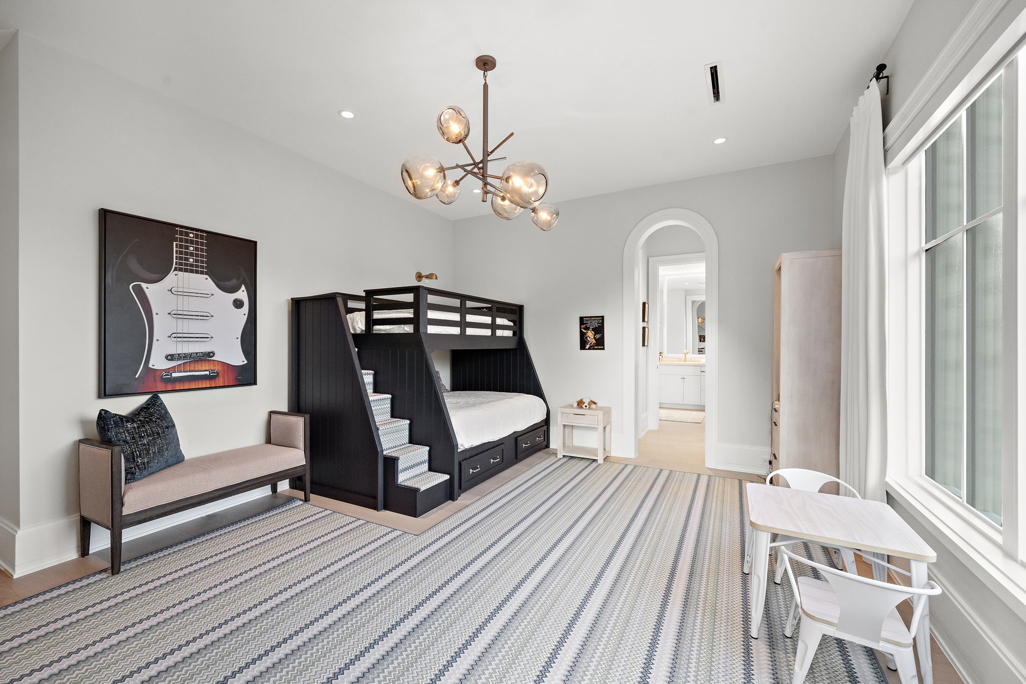3649 Chevy Chase Drive Houston, TX 77019 - Photo 36 of 50 At 17' x 16', this ensuite bedroom features wide plank wood flooring and a detailed archway leading to the walk-in closet and full bath with a tub-shower combination.