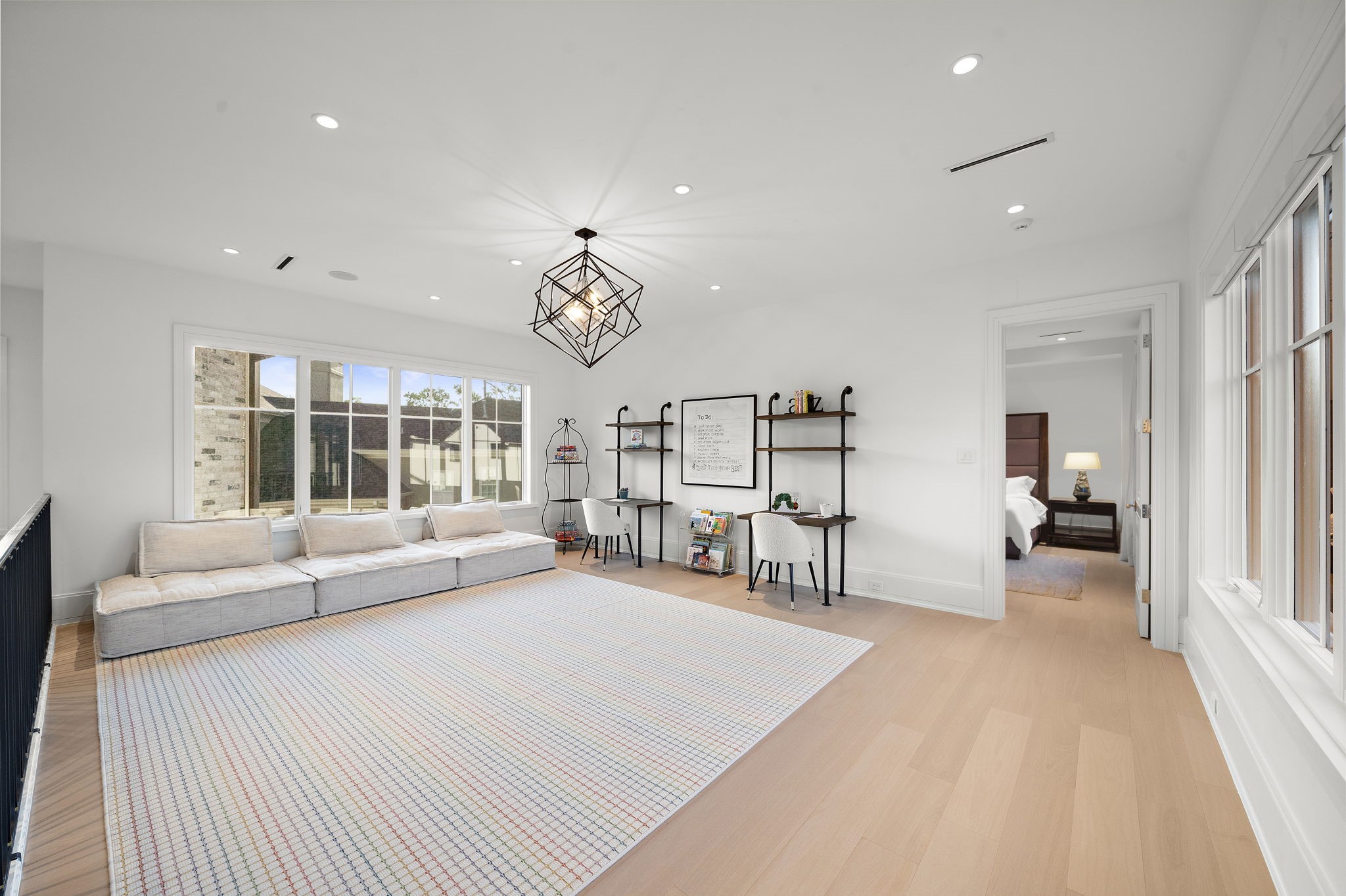 3649 Chevy Chase Drive Houston, TX 77019 - Photo 37 of 50 Continuing the home’s theme of abundant natural light, the 22' x 17' game room is flanked by wall of windows with automatic shades and offers a wet bar and powder bath.
