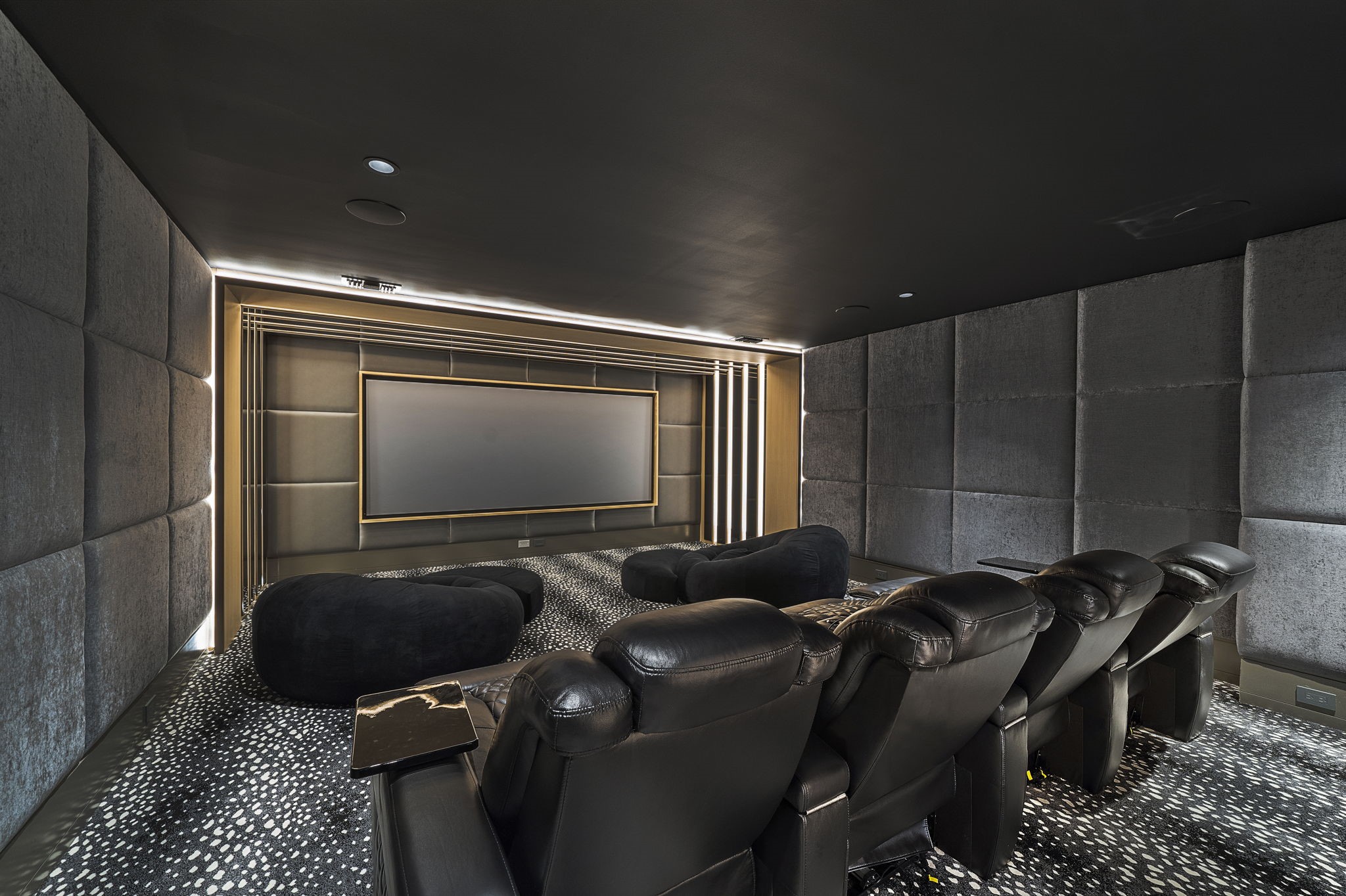 3649 Chevy Chase Drive Houston, TX 77019 - Photo 40 of 50 Soundproofed media room with acoustic wall treatments, perforated theater screen, and integrated lighting, delivering a high-performance private theater experience.