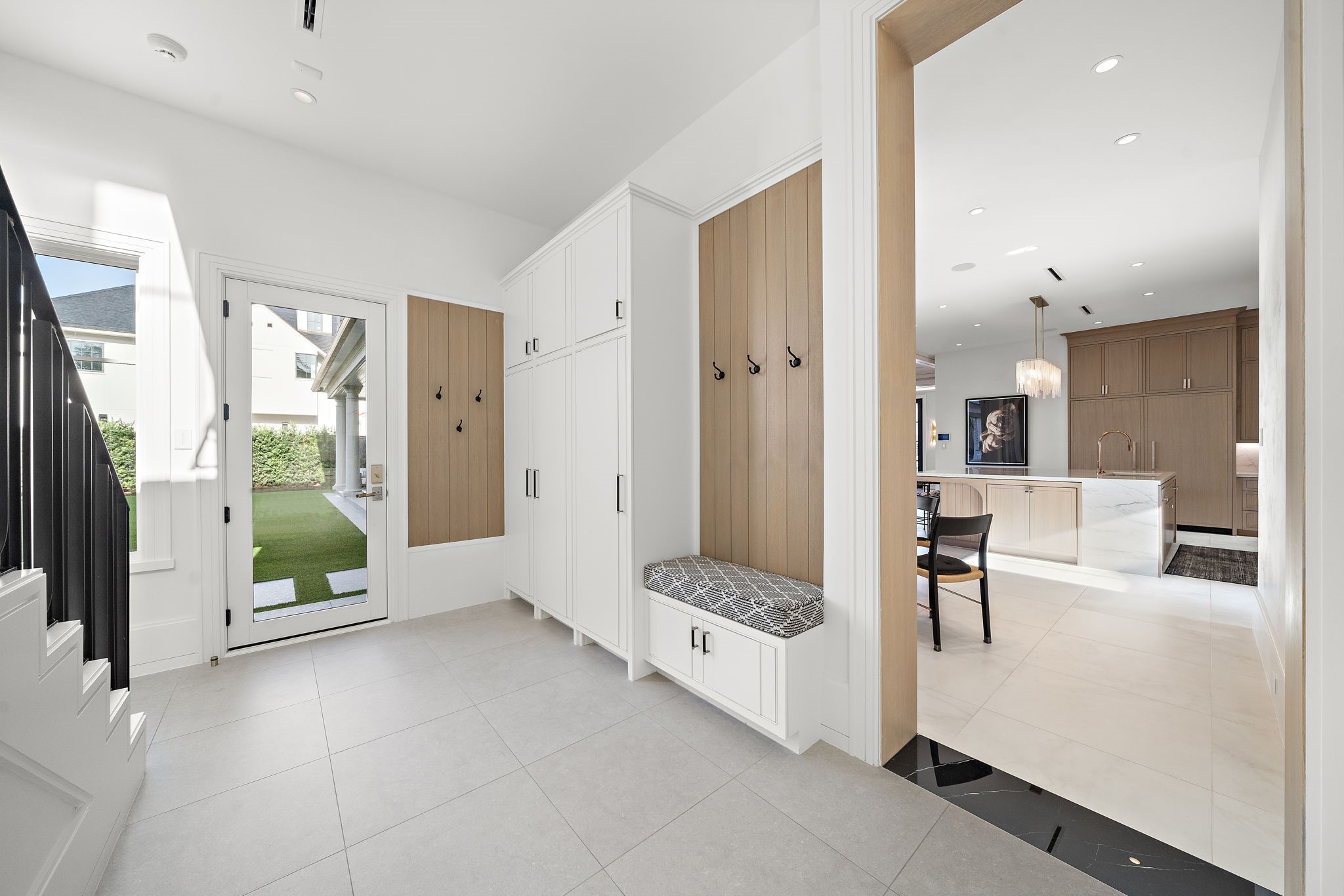 3649 Chevy Chase Drive Houston, TX 77019 - Photo 44 of 50 Mudroom positioned off the back staircase with direct access to the driveway, garage, and first-floor laundry. Exceptional storage continues throughout the home, including multiple storage rooms and massive walk-in attic access.