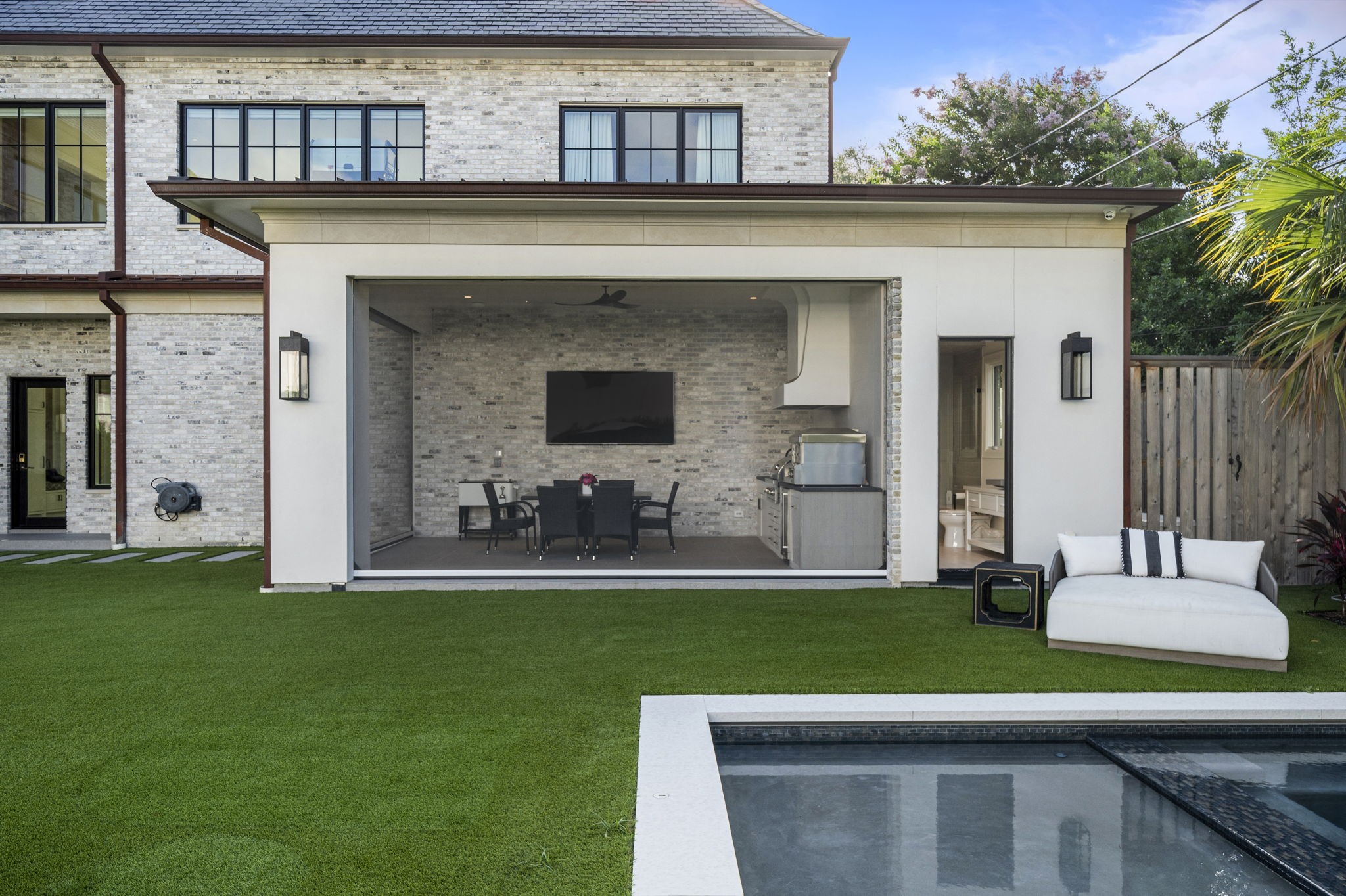 3649 Chevy Chase Drive Houston, TX 77019 - Photo 47 of 50 Summer kitchen with leathered granite counters, sink, grill and refrigerator adjacent to the full pool bath.