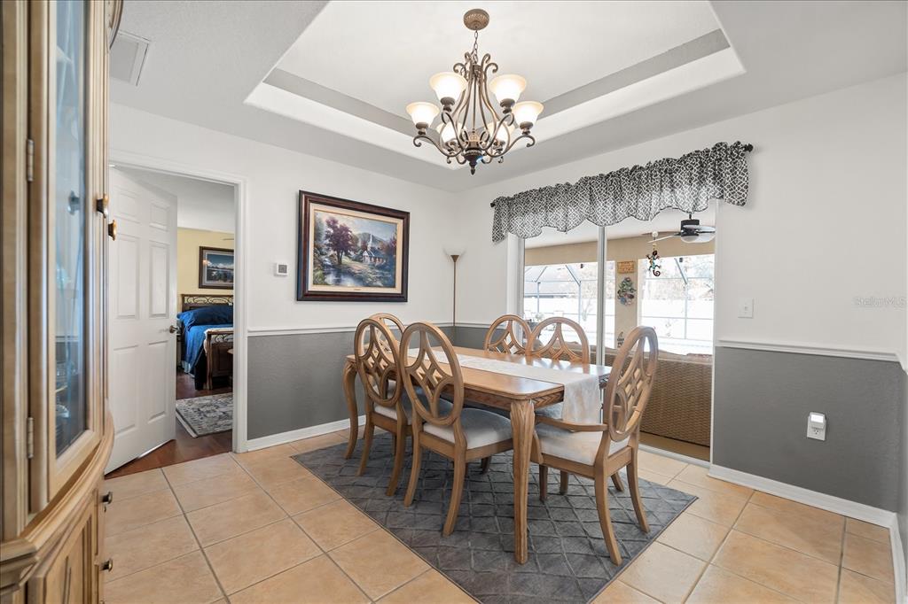 1254 Timberidge Loop South Lakeland, FL 33809 - Photo 15 of 36 a view of a dining room with furniture window and chandelier