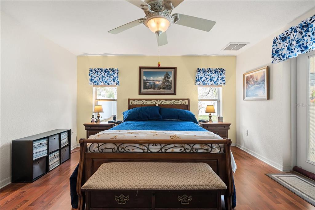 1254 Timberidge Loop South Lakeland, FL 33809 - Photo 19 of 36 a view of a dining room with furniture a chandelier and wooden floor