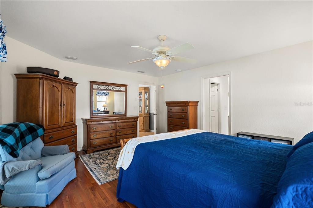 1254 Timberidge Loop South Lakeland, FL 33809 - Photo 20 of 36 a bedroom with a bed dresser and a window