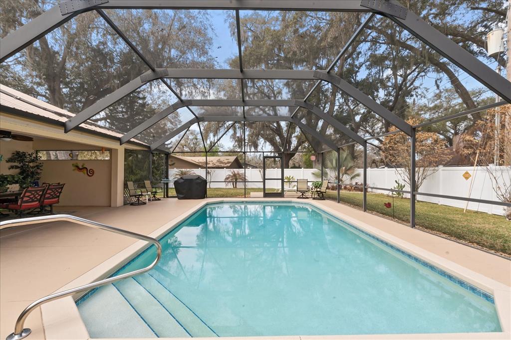 1254 Timberidge Loop South Lakeland, FL 33809 - Photo 2 of 36 a view of a backyard with a swimming pool