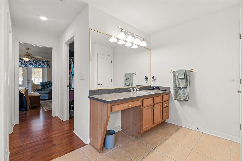 1254 Timberidge Loop South Lakeland, FL 33809 - Photo 22 of 36 a kitchen with stainless steel appliances granite countertop a sink and a refrigerator