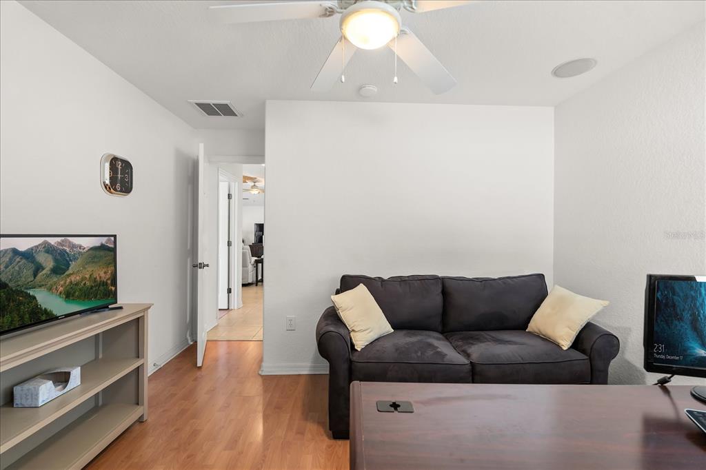 1254 Timberidge Loop South Lakeland, FL 33809 - Photo 25 of 36 a living room with furniture and a flat screen tv