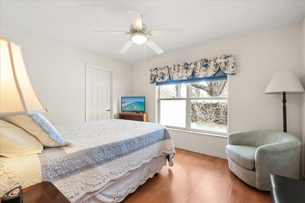 1254 Timberidge Loop South Lakeland, FL 33809 - Photo 27 of 36 a bedroom with a large bed and a window
