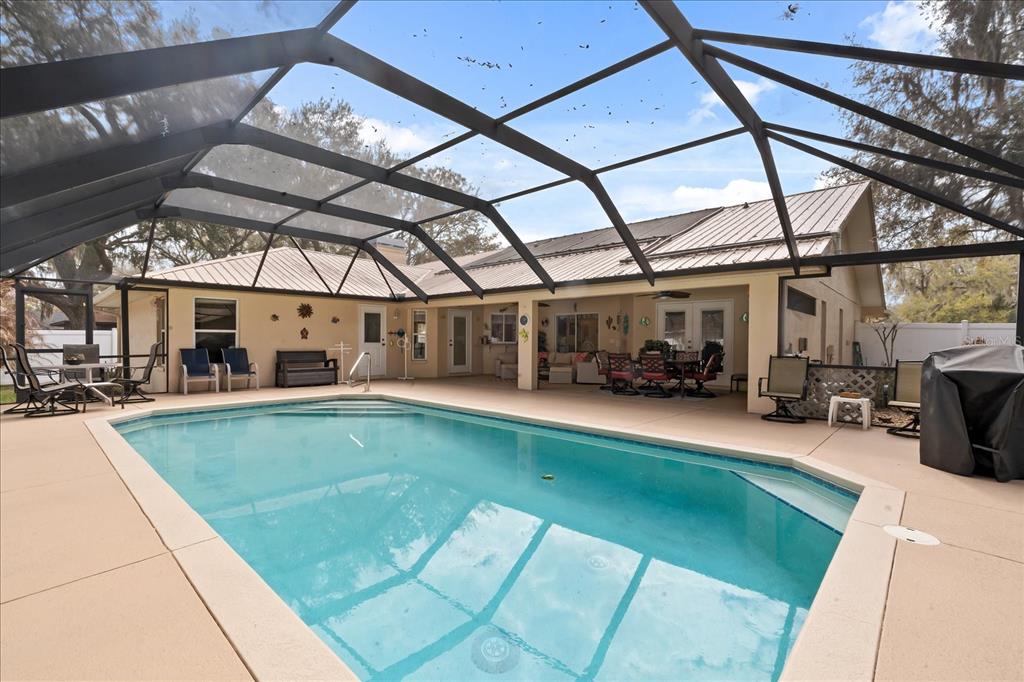 1254 Timberidge Loop South Lakeland, FL 33809 - Photo 32 of 36 a view of a swimming pool with a patio