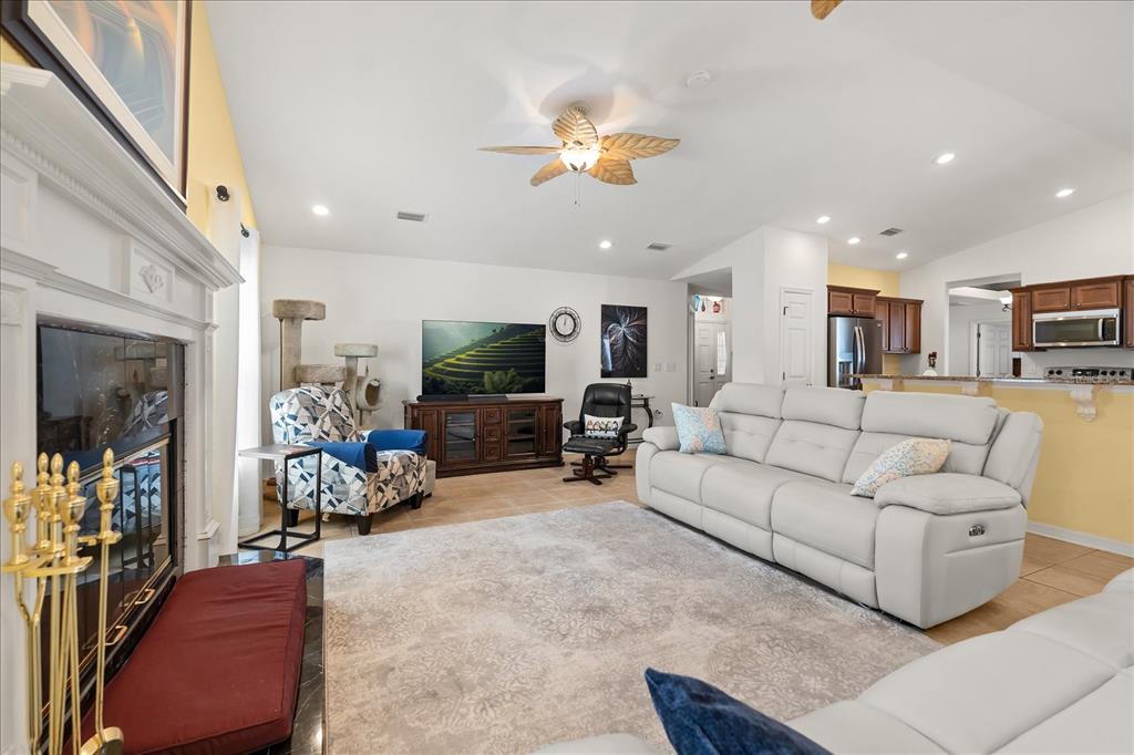 1254 Timberidge Loop South Lakeland, FL 33809 - Photo 5 of 36 a living room with furniture and a flat screen tv