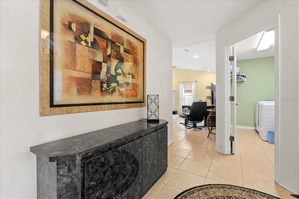 1254 Timberidge Loop South Lakeland, FL 33809 - Photo 8 of 36 a hallway with a view of living room