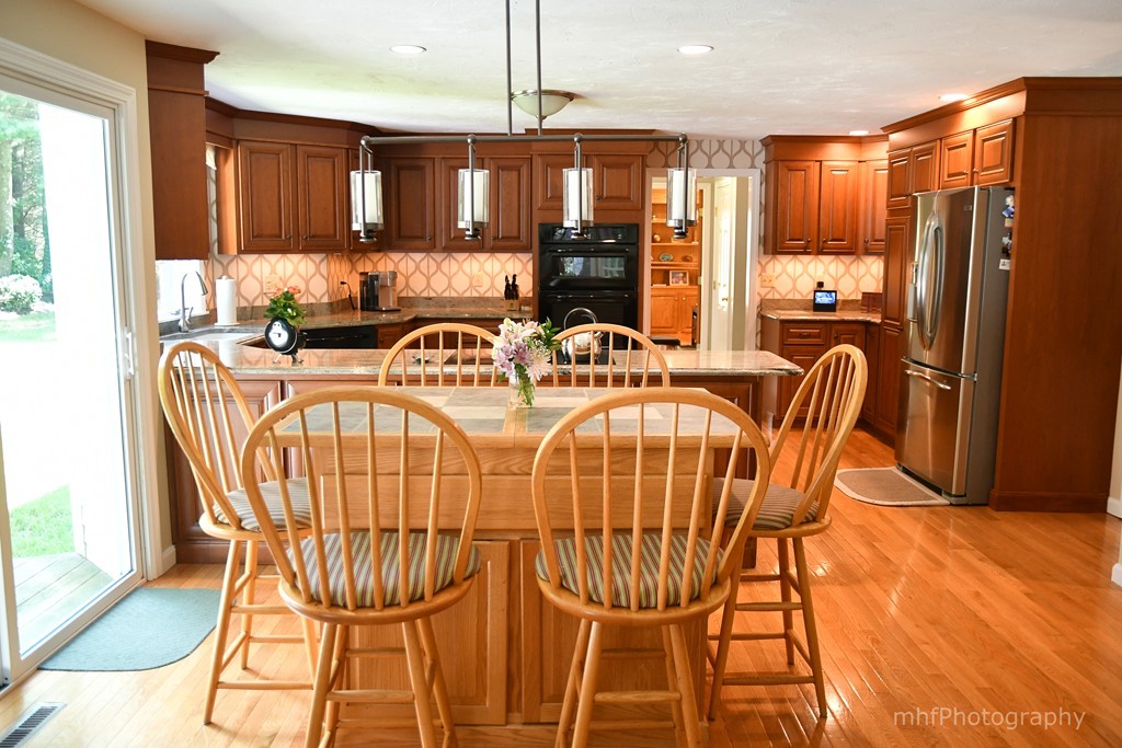 82 Cranberry Circle Sudbury, MA 01776 - Photo 11 of 30 a view of a dining room with furniture window and outside view