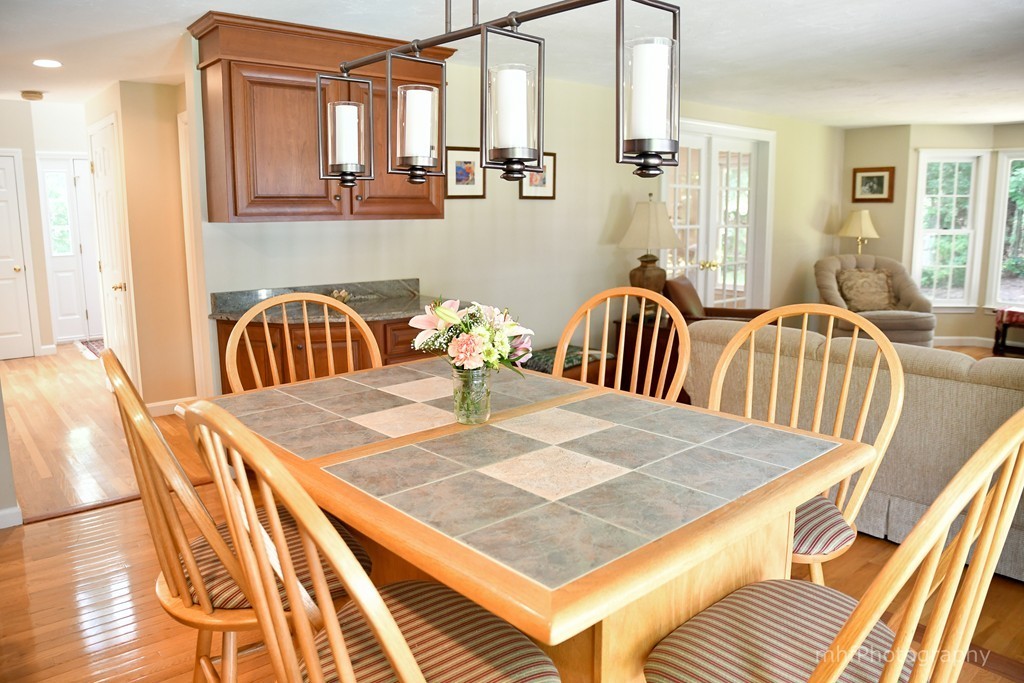 82 Cranberry Circle Sudbury, MA 01776 - Photo 12 of 30 a dining room with a table and chairs